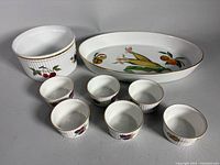 Group shot of all eight Royal Worcester Evesham pieces