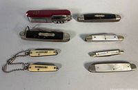 Group shot of all eight pocket knives