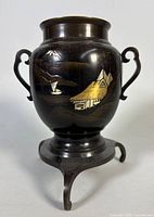 Front view of bronze usubata with landscape inlay and stand