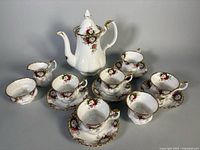 Entire set: coffee pot, sugar, creamer, teacups and saucers