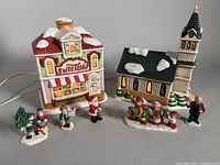 Overview of both lighted buildings and five figurines