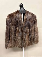 Full front view of silver fox fur vest on mannequin