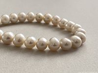 close-up of pearl strand showing size, shape and lustre