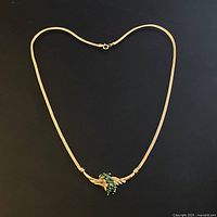 Full view of gold omega chain necklace with pendant