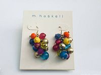 Front view of earrings on m. haskell card