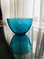 side view of textured blue glass bowl