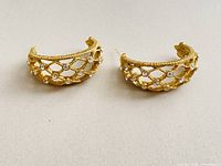 Pair of gold-plated open lattice semi-hoop earrings with rhinestones, fronts visible