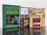 Front view of all three hardcover books standing upright