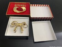 Both brooches and three gift boxes