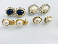 All four pairs earrings arranged