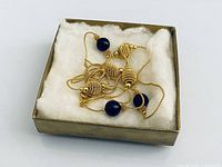 Necklace coiled in presentation box showing overall appearance