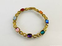 Full view of gold plated bracelet showing all eight colored stones