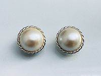 Front view of both faux pearl clip-on earrings