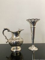 Pitcher and vase side by side