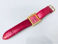 Front view of full watch with strap extended showing dial, bezel and band