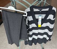 Sweater and pants hanging on chair