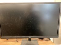 Front view of LG monitor powered off showing screen and bezel