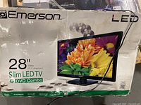 Front of Emerson Slim LED TV box showing model and size