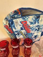 Soft cooler bag with three red Molson Canadian boot mugs