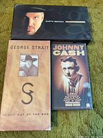 Three country CD box sets: Garth Brooks, George Strait, Johnny Cash