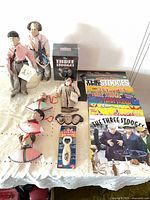 Overall view of dolls, calendars, ornaments, bottle opener and DVD set