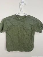 Full front view of green Old Navy T-shirt on hanger