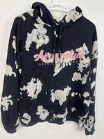 Full front view of hoodie showing design, pocket, hood and bleach pattern