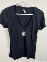 Front view of V-neck t-shirt on hanger