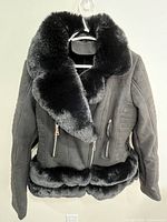Front view of faux suede jacket with faux fur collar and hem