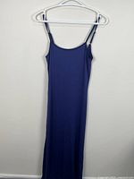 Front view of full-length navy blue slip dress on hanger