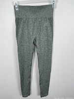 Front view of leggings hung on clip hanger