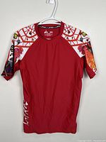 Front view of Lafroi red graphic athletic T-shirt on hanger