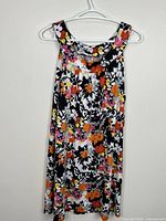 Full view of front of floral dress on hanger