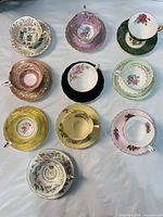 Top-down layout of all 10 teacup and saucer sets