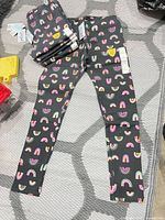 Full view of one legging with additional pairs stacked