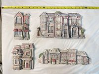 Group shot of all four CitiScapes resin wall plaques on flat surface with tape for scale