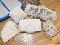 Full set laid out: throw, memory-foam pillow, three decorative pillows, two lace pillowcases