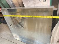 Full view of galvanized pan with tape across width