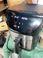 Front view of Gourmia air fryer powered on showing LED display