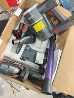 Vacuum body, extension wand, motorized head, accessories and charger inside box