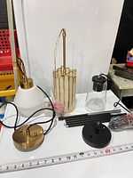 All three pendant fixtures unassembled with canopies, rods and wiring