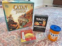 Group shot of the four game packages on rug