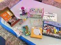 Overview of all craft kits and supplies laid out on mat