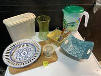 All items grouped: pitcher, trays, basket, utensils, board, vase, container, mortar