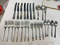 Full layout of knives, forks, spoons and serving pieces