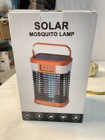 Retail box showing product image and Solar Mosquito Lamp labeling