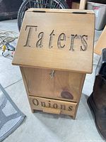 Front view showing lid marked Taters, drawer marked Onions