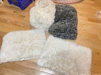 Four faux fur pieces laid out showing colors and texture