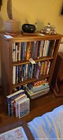 Front view of wooden bookshelf with three shelves