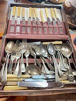 Overall view of open canteen with knives, forks, spoons